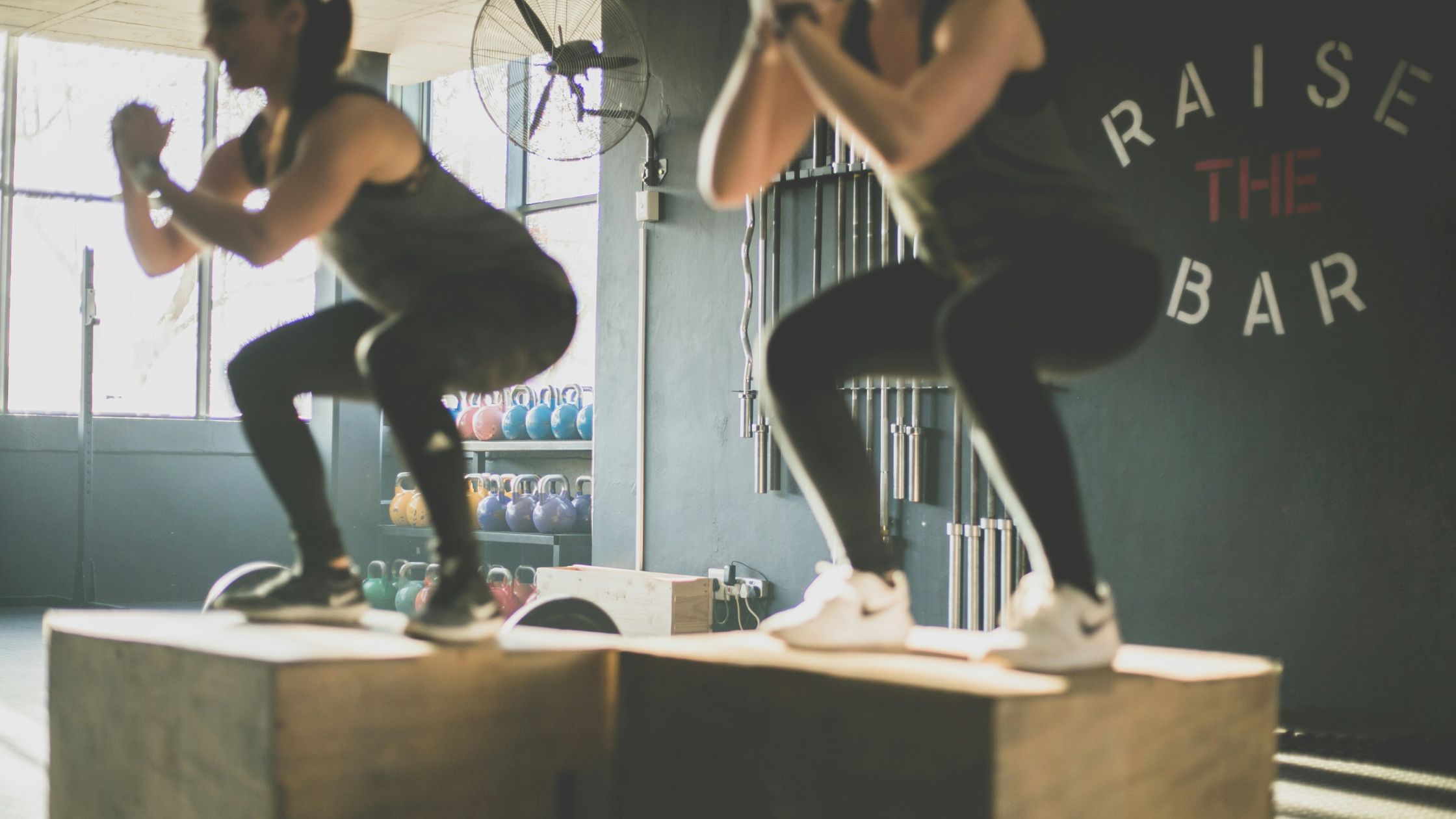 Women doing box jumps together
